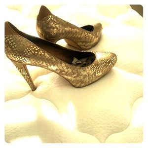 Gold high heel pumps